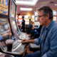 Man checking slot machine RTP screen