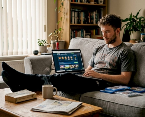 Man playing gamified casino site at home