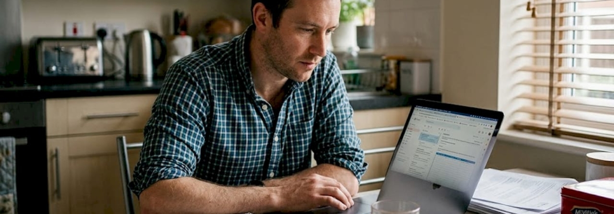 Man using laptop for casino offer research