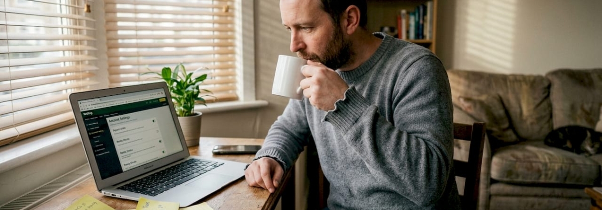 Man reviewing responsible wagering at home